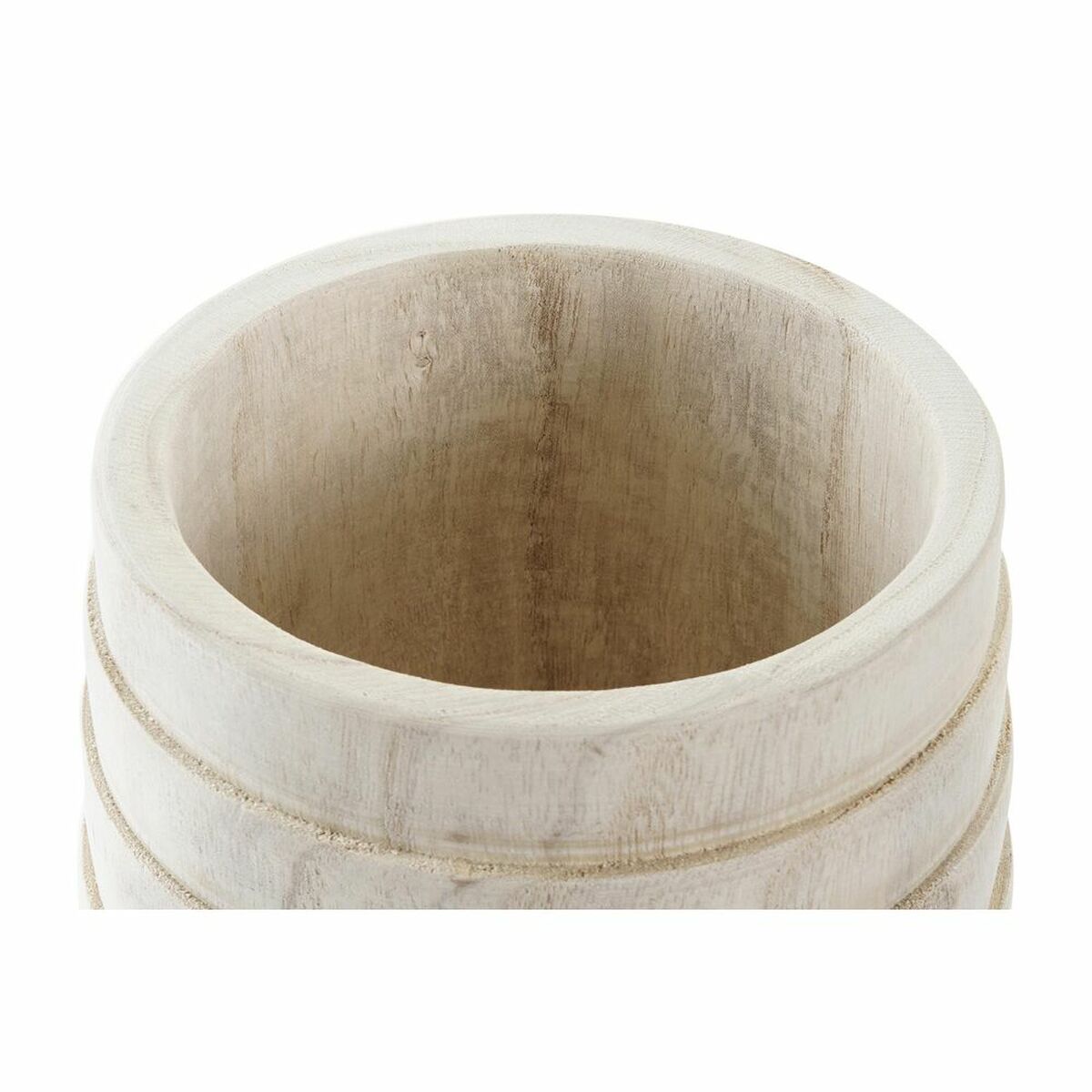 A brown natural planter on the floor of a bedroom, filled with a small potted plant and surrounded by calming decor.