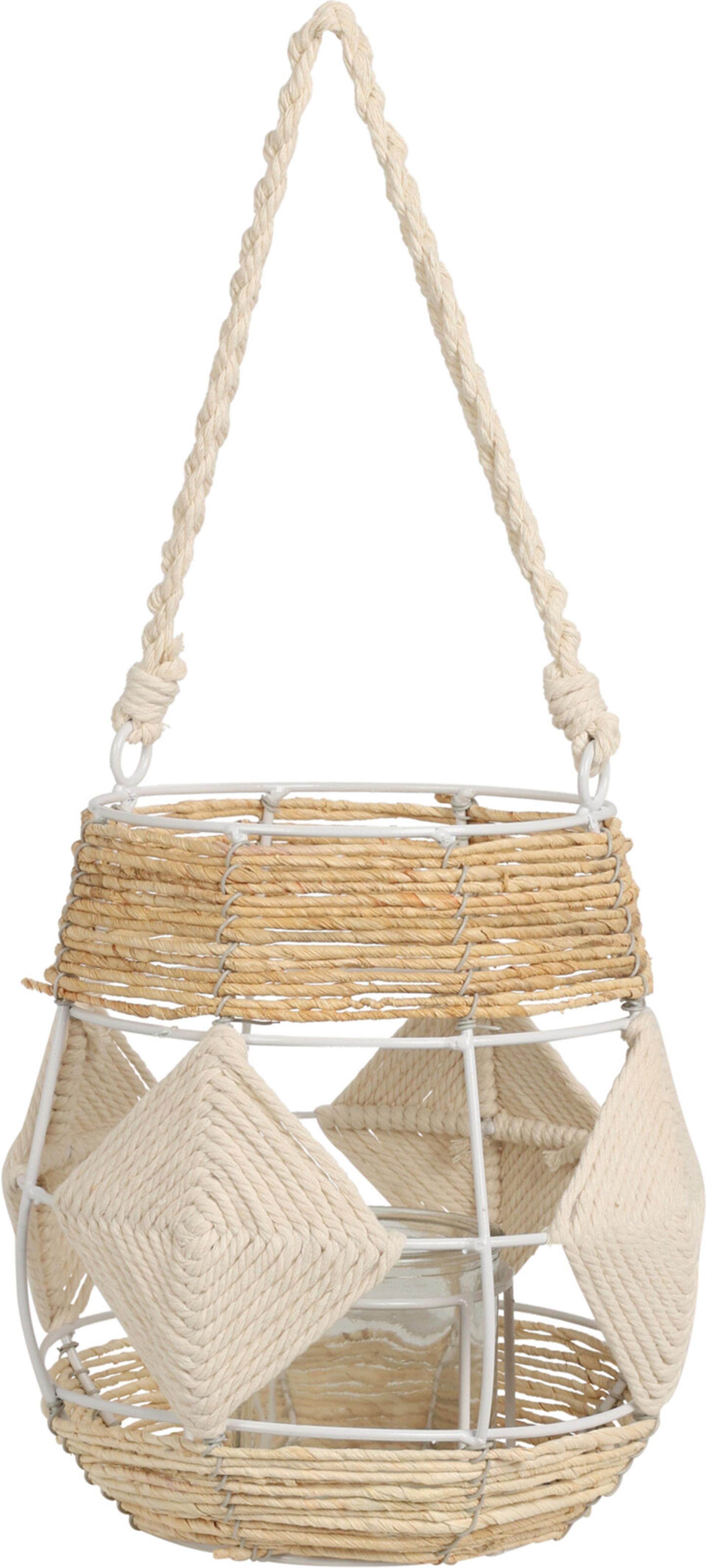 The home styling lantern in a corner of a cozy room, softly glowing with a warm light.