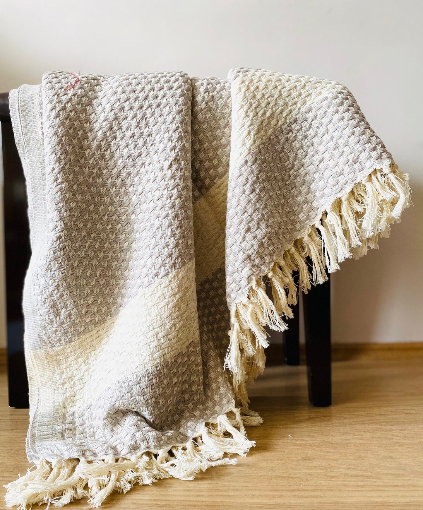 A close-up of the handwoven fibers and texture of The Istanbul Handwoven Cotton blanket